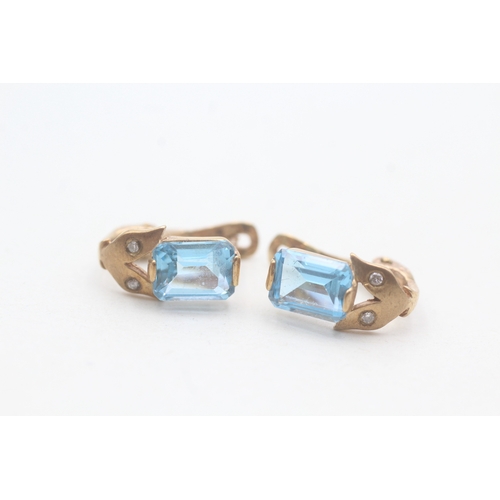 236 - 9ct gold blue topaz & diamond clip and post earrings (2.8g)