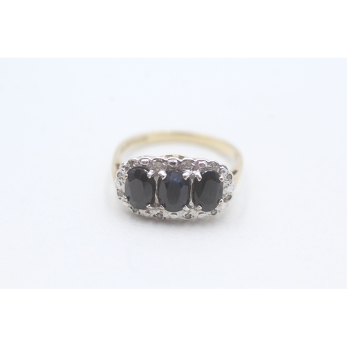 238 - 9ct gold sapphire and diamond trilogy halo ring (2.5g) Size M 1/2