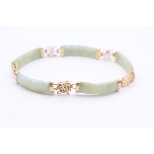 38 - 9ct gold jade bracelet with Chinese symbols (11.8g)