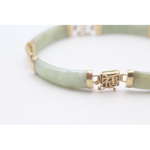 38 - 9ct gold jade bracelet with Chinese symbols (11.8g)