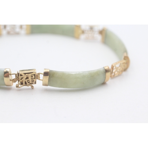 38 - 9ct gold jade bracelet with Chinese symbols (11.8g)