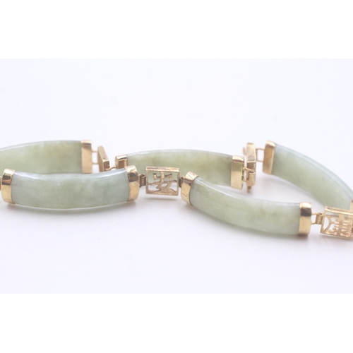 38 - 9ct gold jade bracelet with Chinese symbols (11.8g)