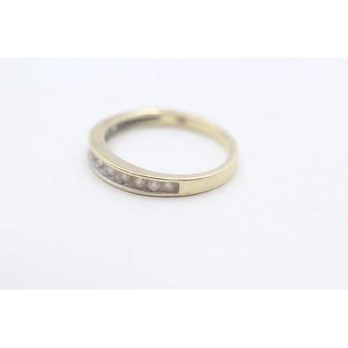 65 - 9ct gold diamond channel set ring (2.1g) Size O