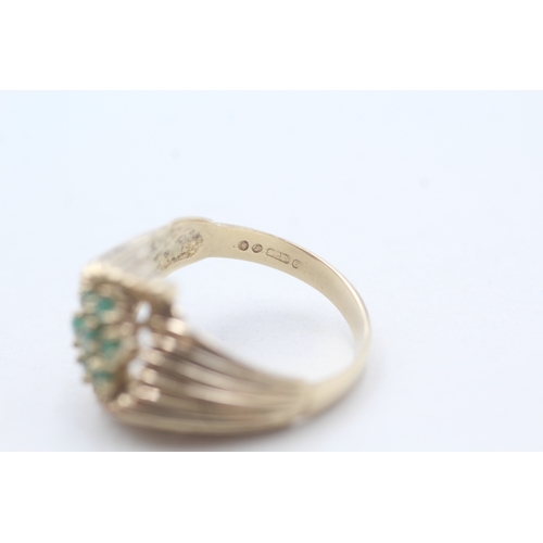 69 - 9ct gold emerald ring (3.8g) Size Q 1/2