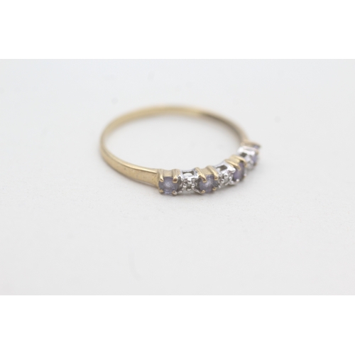 91 - 9ct gold tanzanite & diamond half eternity ring (1g) Size Q 1/2