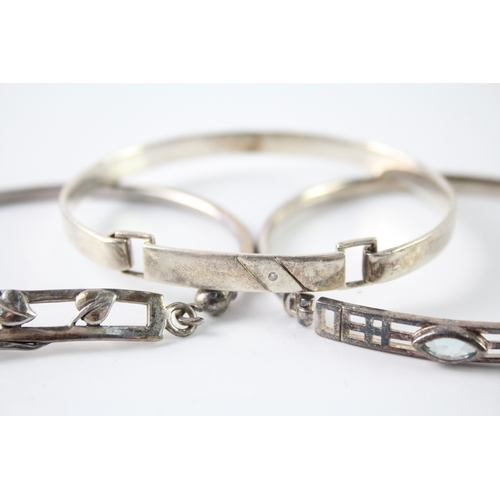 291 - Collection of Sterling Silver Bangles inc. Celtic, Diamond, Topaz x 3 33g