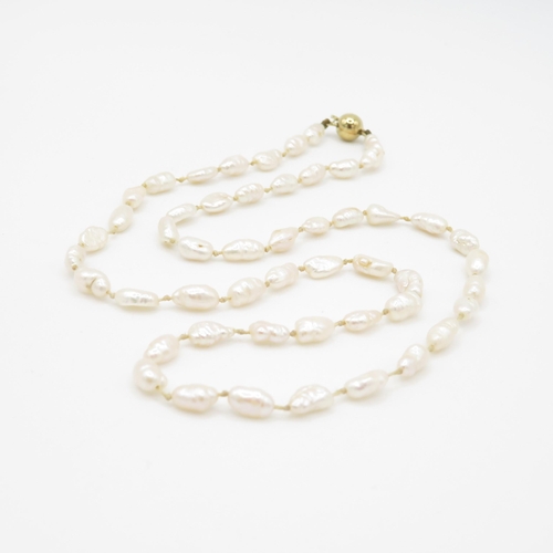 63 - 14ct gold rice pearl necklace (10.8g)