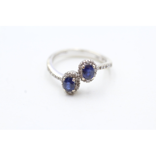 105 - 18ct white gold sapphire and diamond twin halo ring (4g) Size O