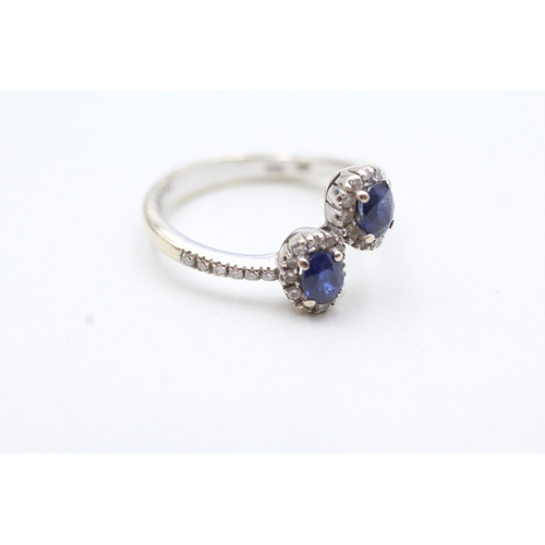 105 - 18ct white gold sapphire and diamond twin halo ring (4g) Size O