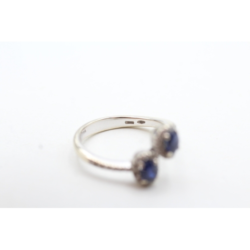 105 - 18ct white gold sapphire and diamond twin halo ring (4g) Size O