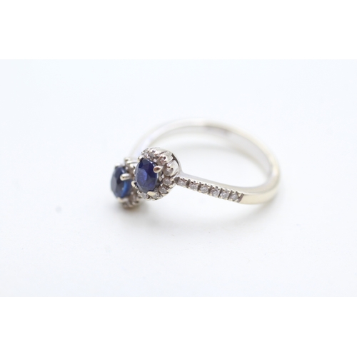 105 - 18ct white gold sapphire and diamond twin halo ring (4g) Size O