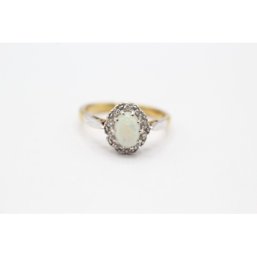 110 - 18ct gold opal and diamond halo ring (3.9g) Size M