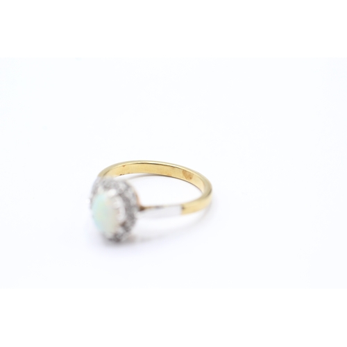 110 - 18ct gold opal and diamond halo ring (3.9g) Size M