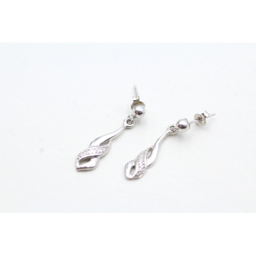 129 - 9ct white gold diamond drop earrings (0.9g)