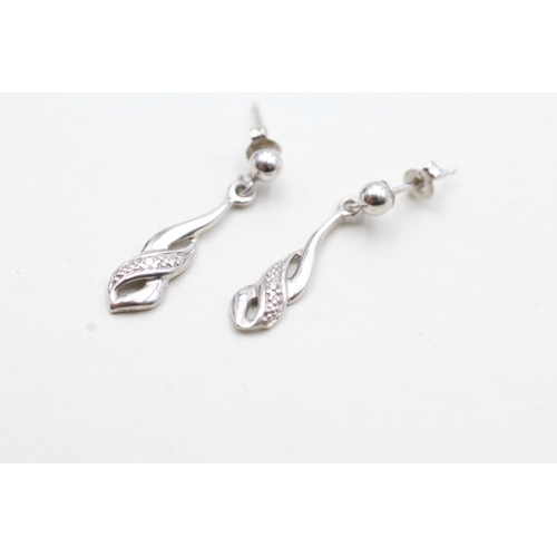 129 - 9ct white gold diamond drop earrings (0.9g)