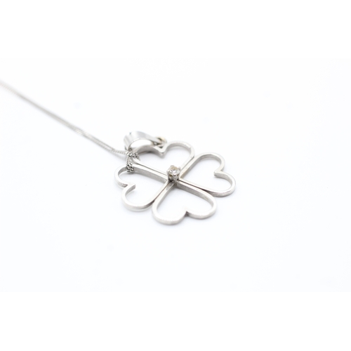 131 - 18ct gold diamond four leaf clover pendant with 9ct gold chain (2.6g)