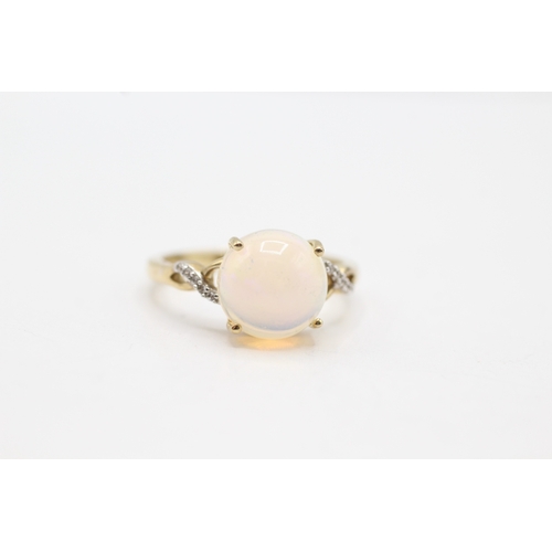 146 - 9ct gold cabochon opal & white gemstone dress ring (2.6g) Size N