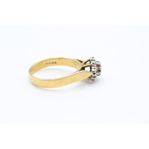 159 - 18ct gold diamond halo ring (4.3g) Size O