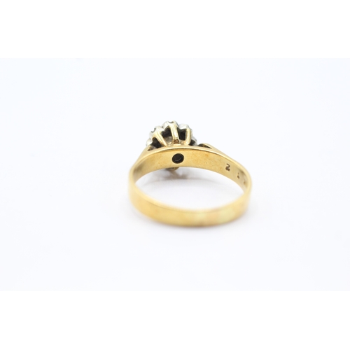 159 - 18ct gold diamond halo ring (4.3g) Size O