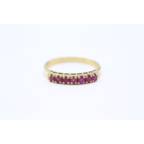 164 - 18ct gold ruby half eternity ring (2.5g) Size P