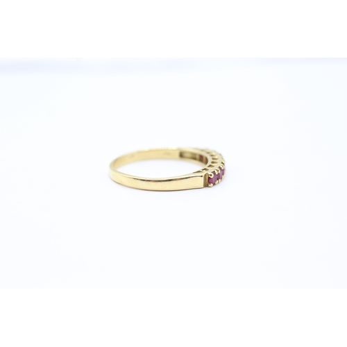 164 - 18ct gold ruby half eternity ring (2.5g) Size P