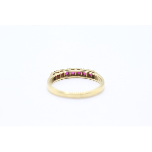 164 - 18ct gold ruby half eternity ring (2.5g) Size P