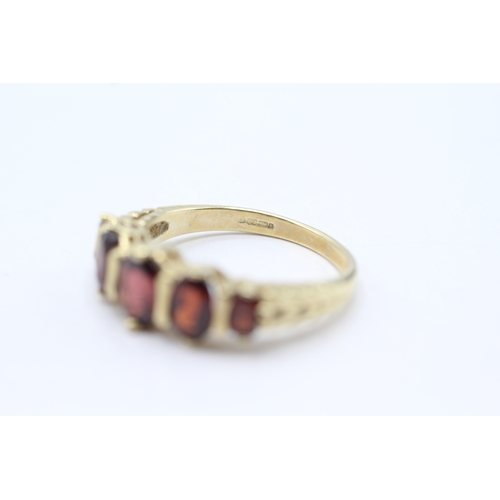 179 - 9ct gold garnet five stone ring (3.3g) Size N