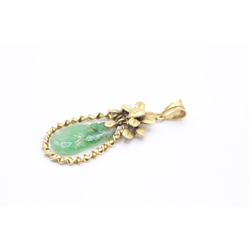 188 - 14ct gold vintage carved jade floral pendant (2.5g)