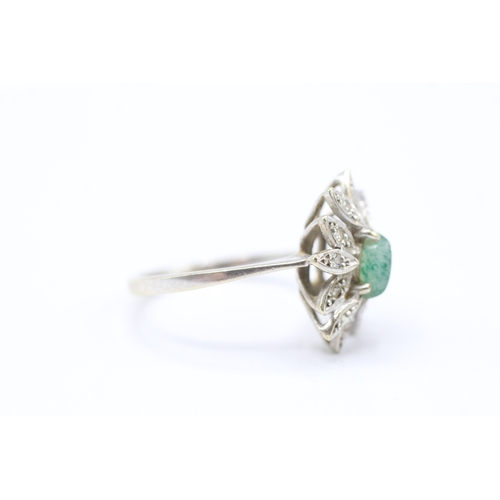 203 - 14ct white gold diamond and green gemstone halo ring (3.3g) Size M