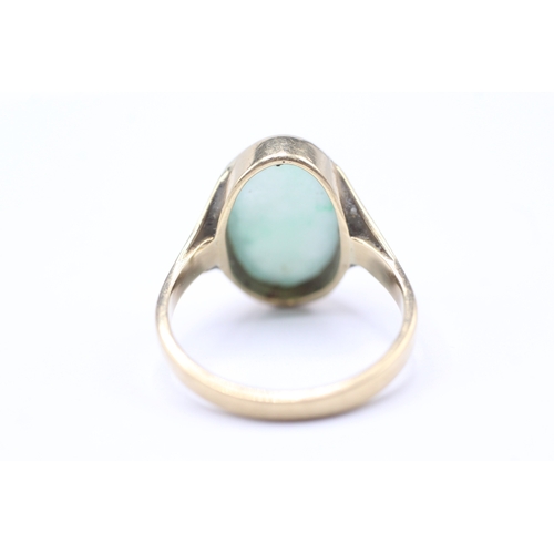 204 - 9ct gold bezel set jade dress ring (4.7g) Size P 1/2