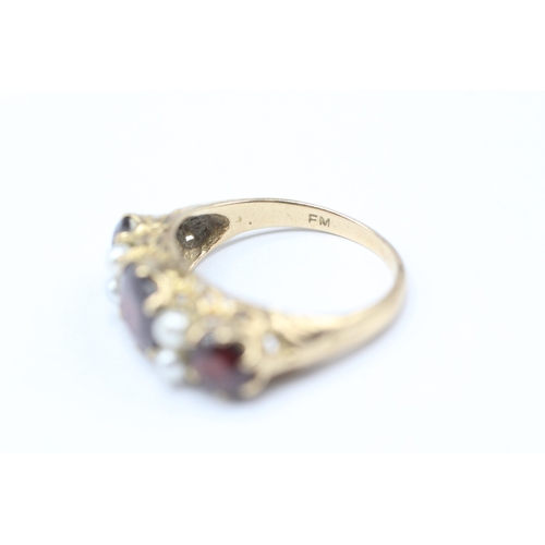 21 - 9ct gold garnet and faux pearl ring (2.9g) Size M