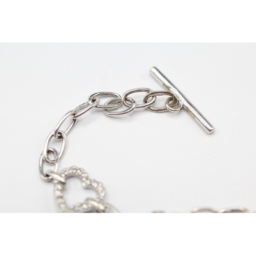 212 - 18ct white gold diamond and sapphire heart bracelet (5.6g)