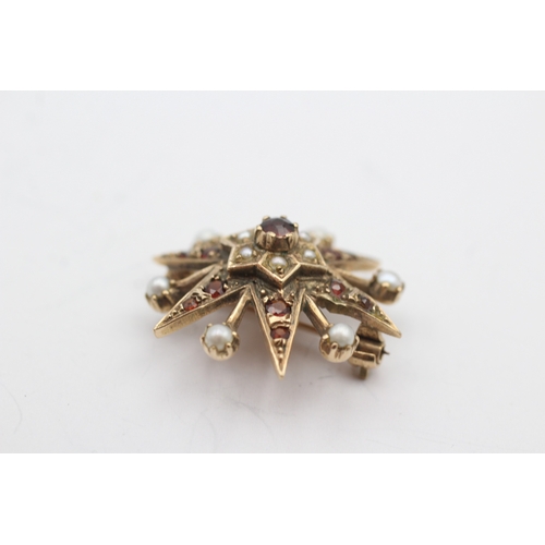 229 - 9ct gold garnet and culture pearl star brooch (4.6g)