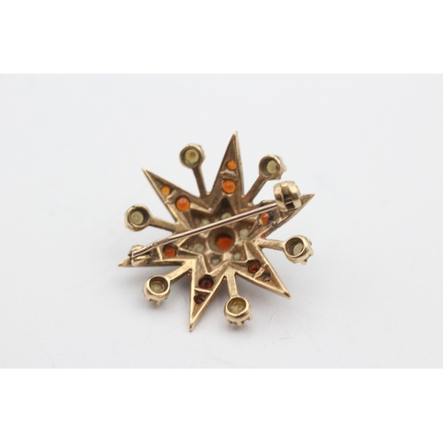 229 - 9ct gold garnet and culture pearl star brooch (4.6g)