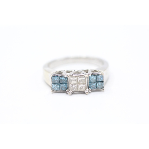 234 - 14ct gold diamond & 'blue' diamond dress ring (5.3g) Size P