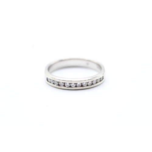 243 - 14ct white gold diamond channel setting ring (3.3g) Size N