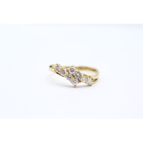 39 - 18ct gold diamond bypass ring (2.6g) Size N