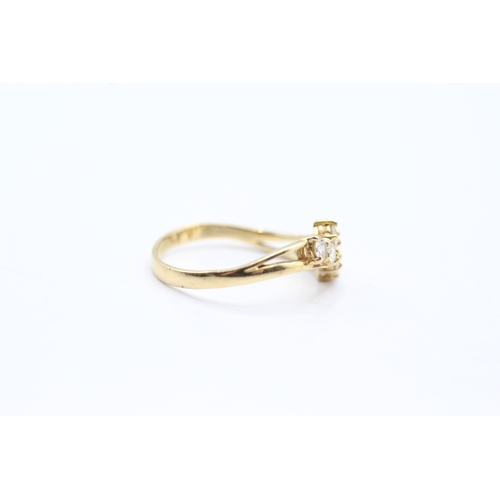 39 - 18ct gold diamond bypass ring (2.6g) Size N