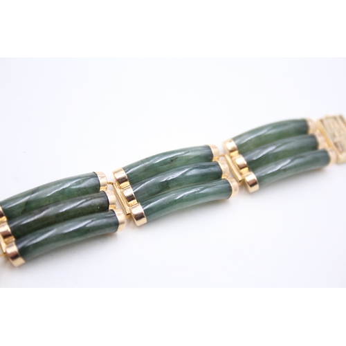 41 - 14ct gold jade bracelet with a Chinese symbol clasp (28.9g)