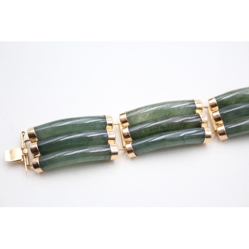 41 - 14ct gold jade bracelet with a Chinese symbol clasp (28.9g)