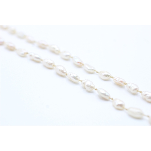 63 - 14ct gold rice pearl necklace (10.8g)