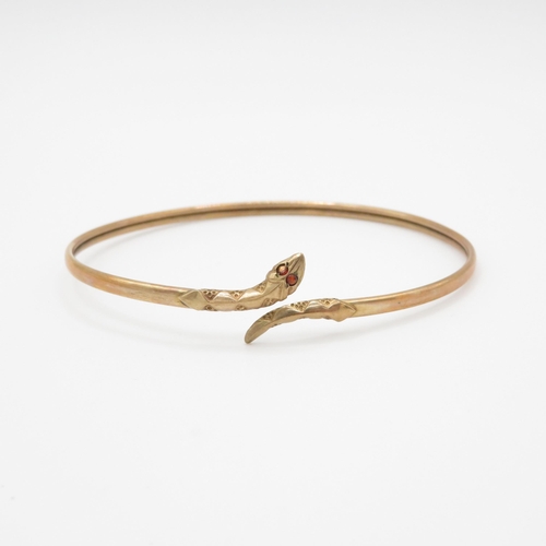 12 - 9ct gold garnet eye snake bangle (5g)