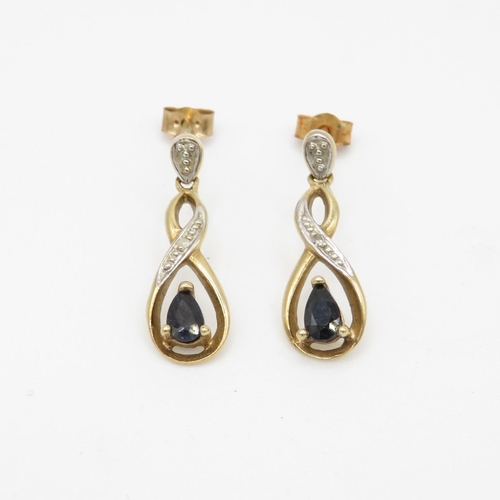 132 - 9ct gold sapphire and diamond twist drop earrings (1.7g)