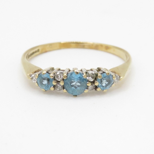 177 - 9ct gold light blue gemstone and diamond ring (1.6g) Size O