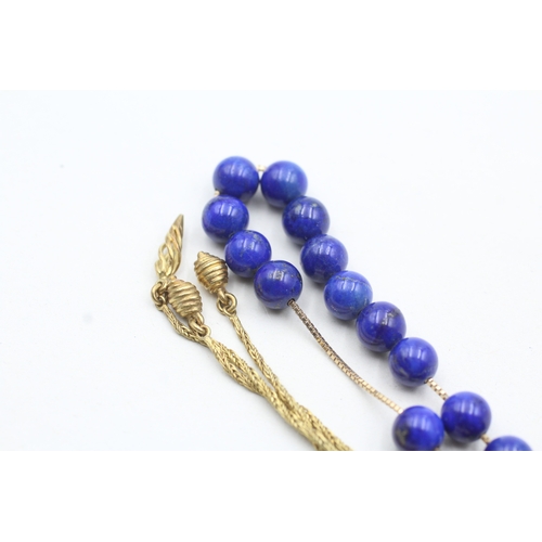 109 - 18ct gold lapis lazuli twist necklace (33.7g)