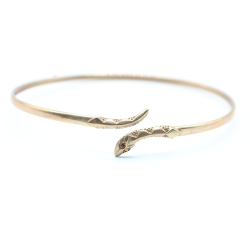 12 - 9ct gold garnet eye snake bangle (5g)