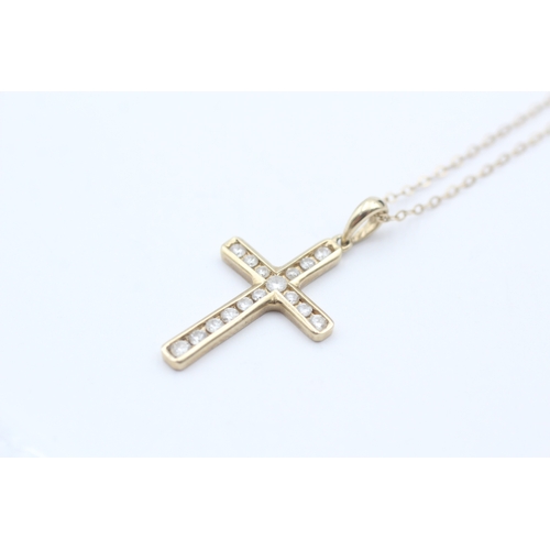 133 - 9ct gold diamond cross pendant on chain (2.2g)