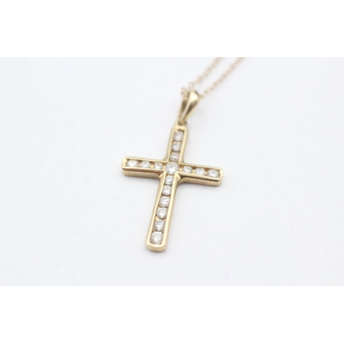 133 - 9ct gold diamond cross pendant on chain (2.2g)