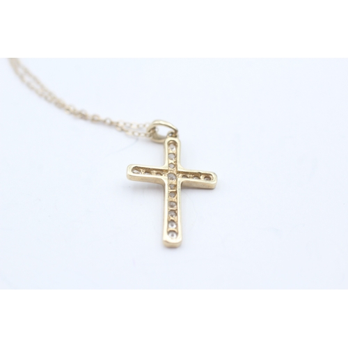 133 - 9ct gold diamond cross pendant on chain (2.2g)