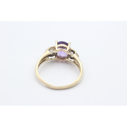 150 - 9ct gold oval purple gemstone and diamond ring (2.3g) Size O